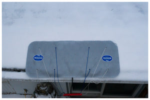 Overhead view of The Ice Dam Remover melting an ice dam on a roof.