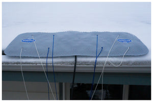 Side view of The Ice Dam Remover melting an ice dam on a roof.