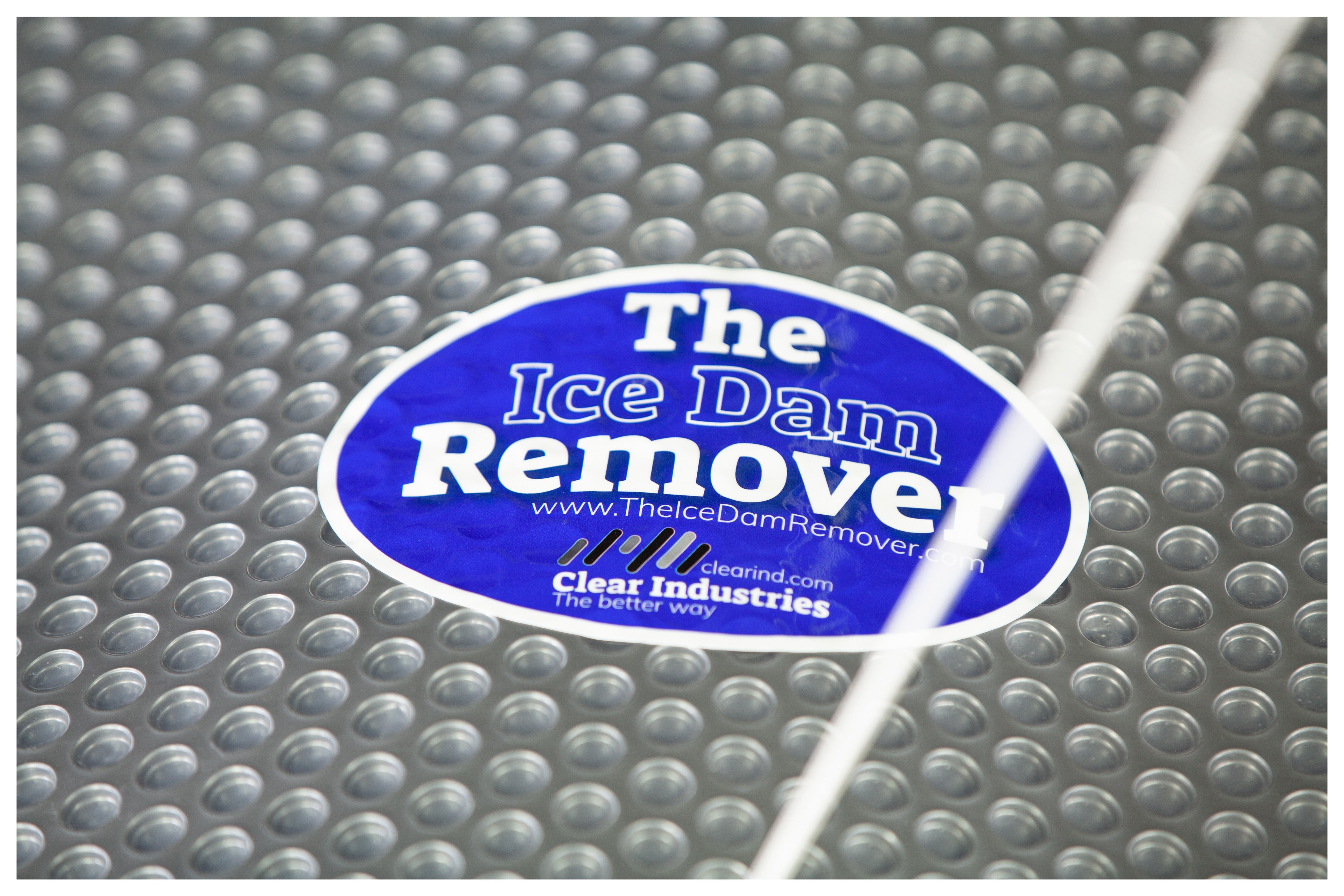 Closeup of The Ice Dam Remover sticker.